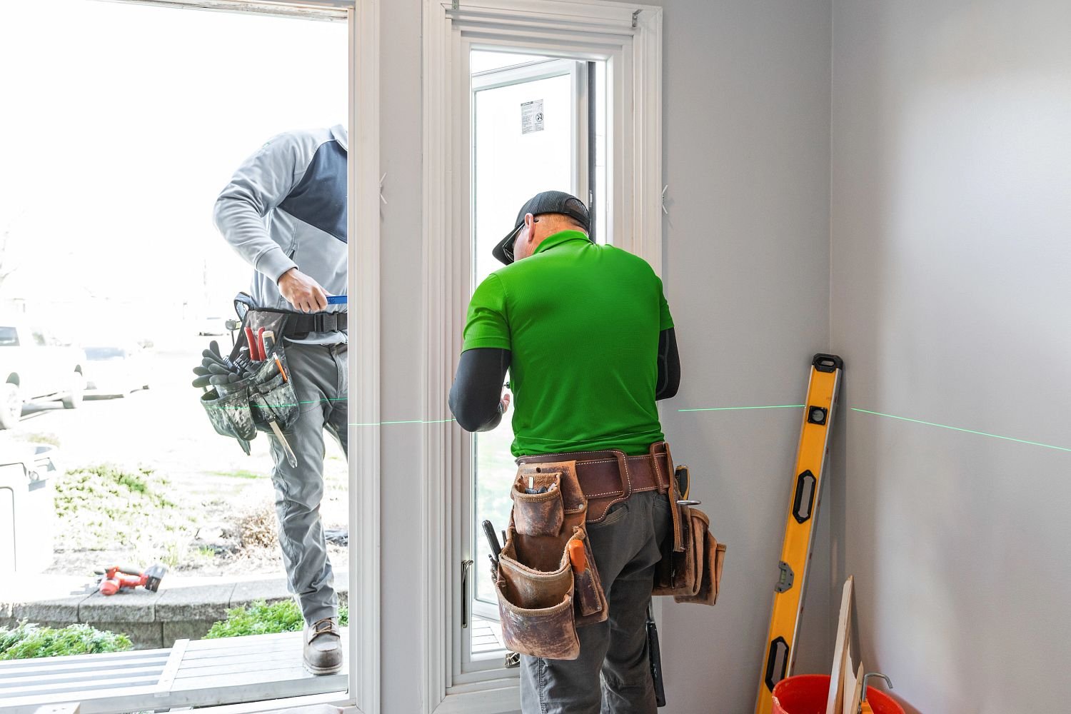 Renewal by Andersen window installer installing a casement window in a home.