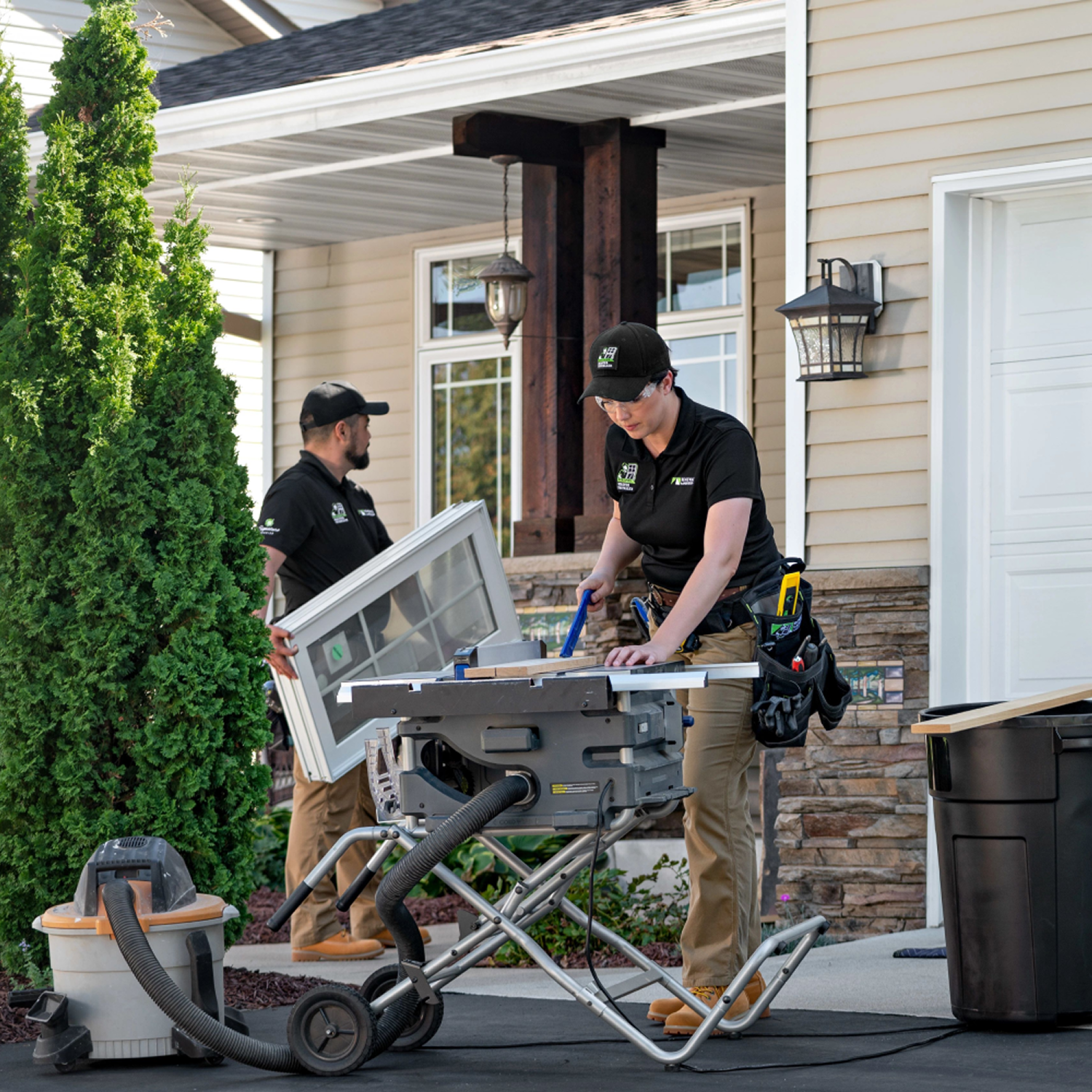 Two Certified Master Installers putting windows in at a client's house.