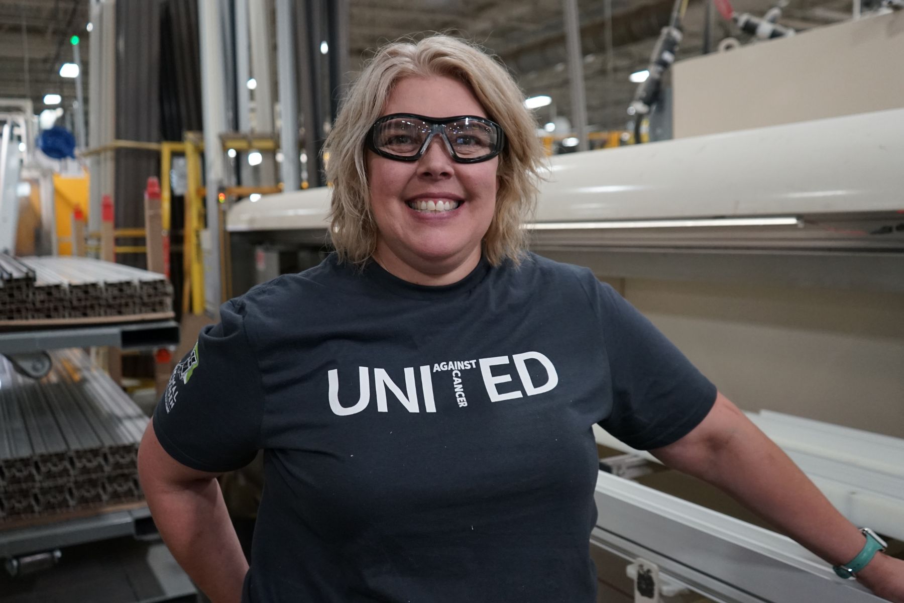 Portrait of RbA manufacturing employee wearing a United Against Cancer t-shirt.