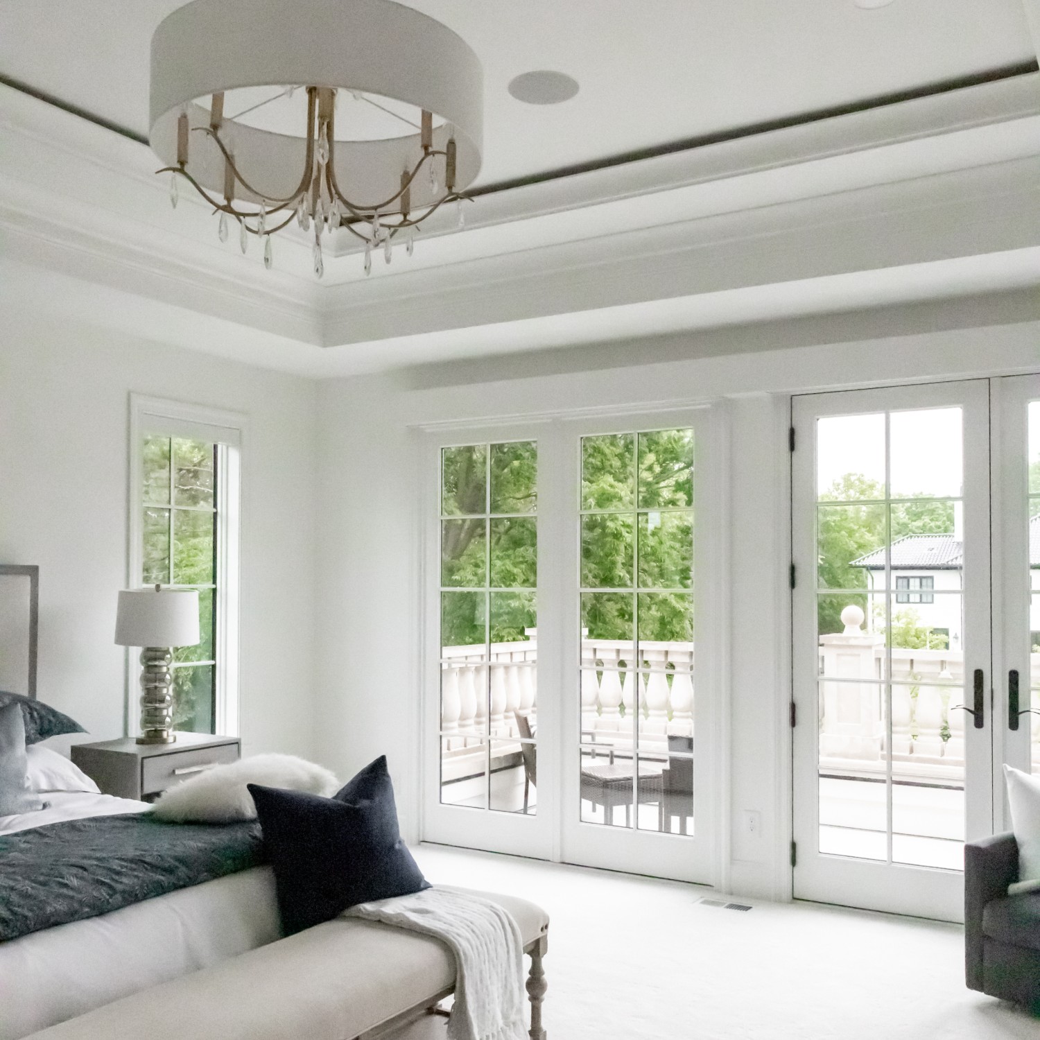 Hinged french patio doors along with fixed patio doors let in a lot of light.