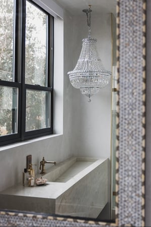 Breegan Jane's bathroom sink with black double hung windows